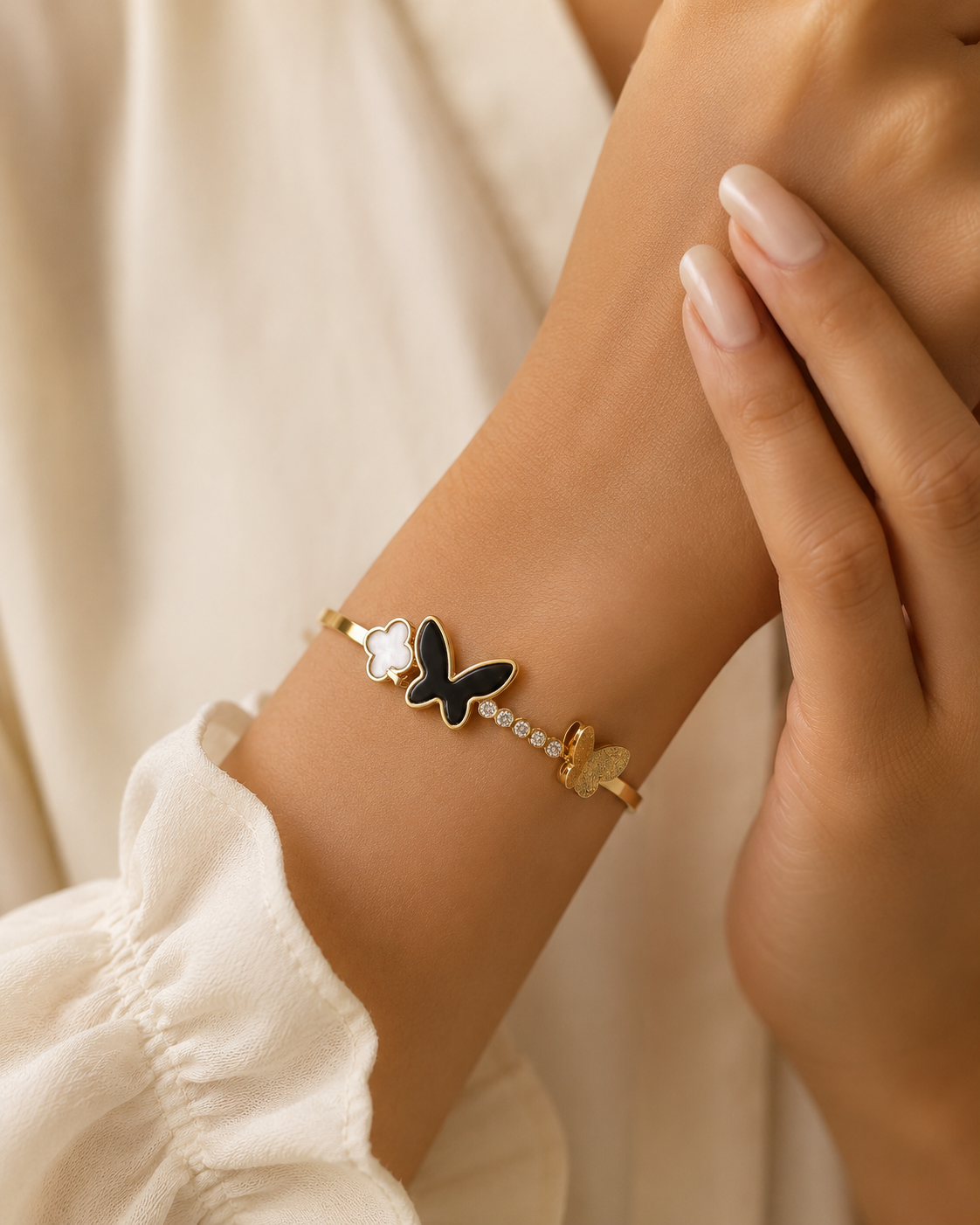 Elegant Butterfly Charm Gold-Tone Bracelet – Black & White Crystal Design