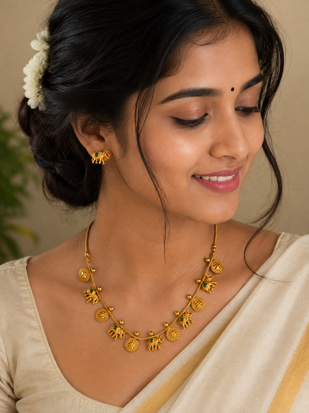 Traditional Elephant Charm Gold-Tone Necklace & Earrings Set with Green Stones
